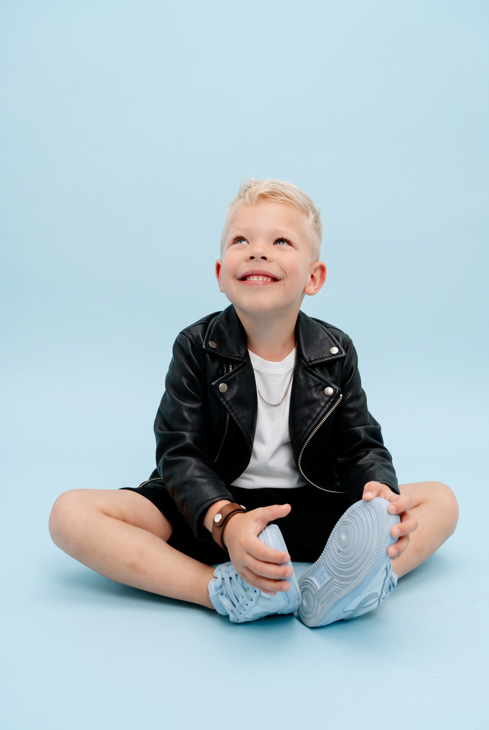 Leather jacket rockstar look on baby blue